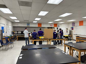 Long view of robotics team at their display table